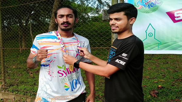 Aminul Islam, a student of MC College, won a medal in the marathon